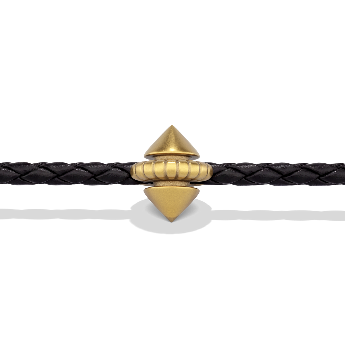Close-up of the gold signature stud on the braided leather of the Harlow Stud Leather Bracelet