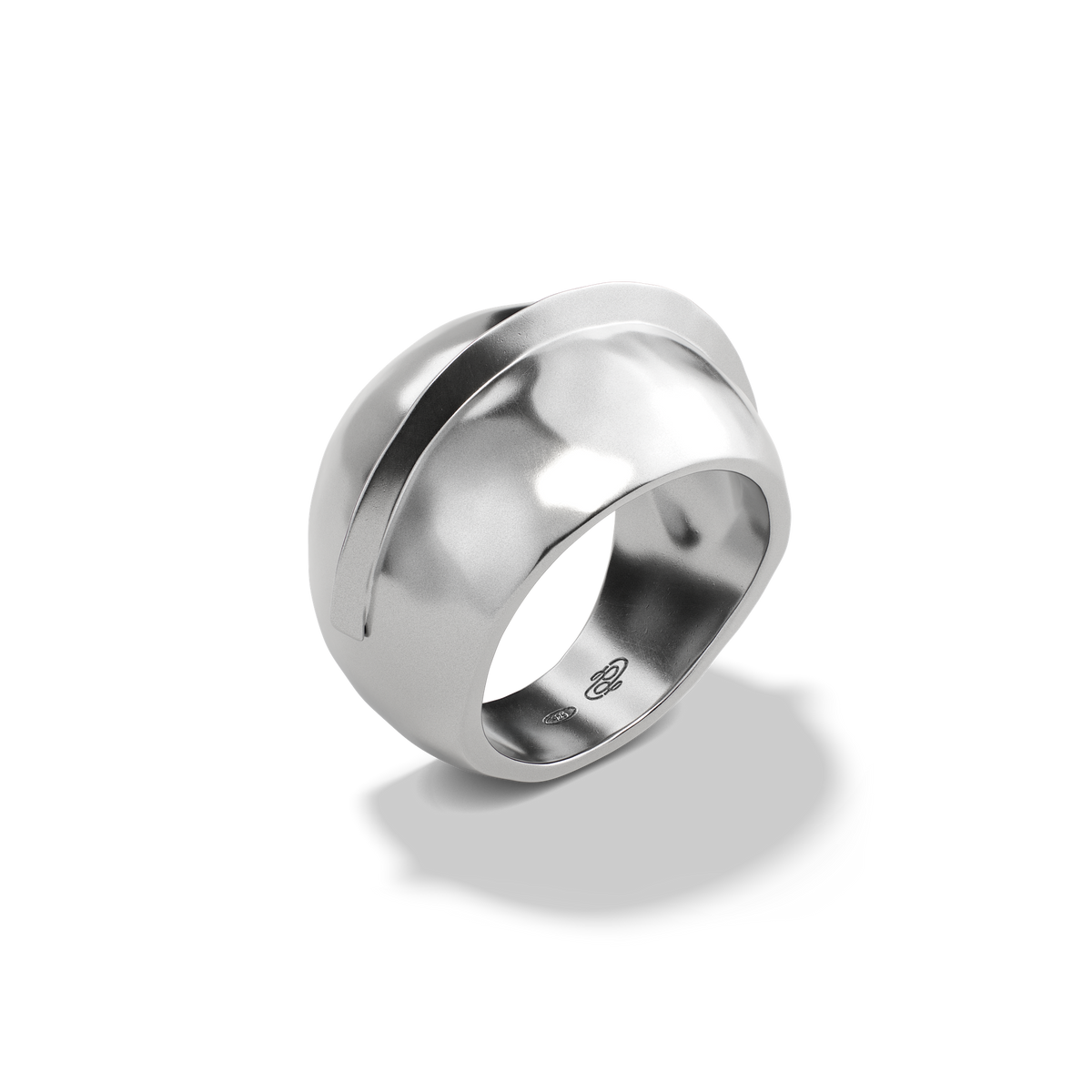 Harlow Arch Ring in sterling silver at a three-quarter angle, showing the arch band wrapping the dome