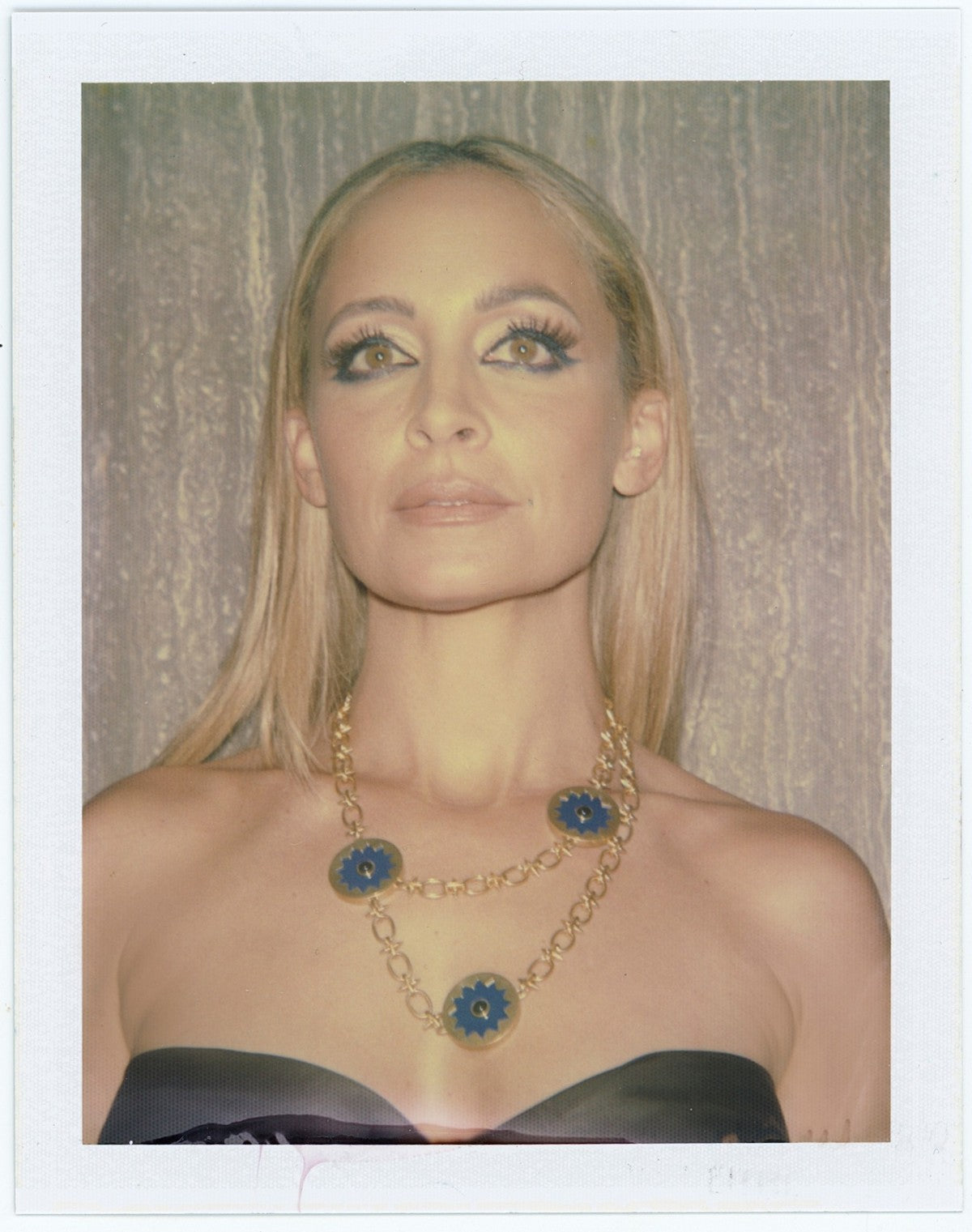 Polaroid of Nicole Richie wearing the Sunburst Layering Necklace in blue lapis