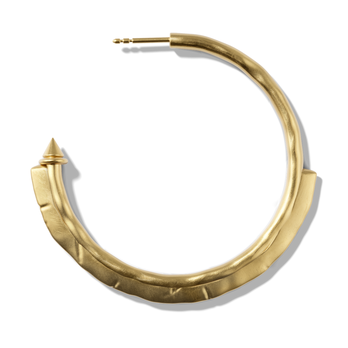 Close-up of a single Harlow Arch Hoop in 14k gold plate, showing the hammered arch and stud tip