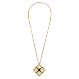 Hathor Spinning Pendant Necklace laid out full length on its gold chain