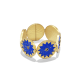Sunburst Statement Bracelet in 14k gold plate with linked lapis suns and black onyx centers, three-quarter view