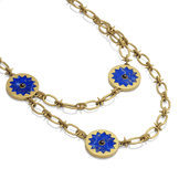 Sunburst Layering Necklace in 14k gold plate with three lapis sun medallions on a spiked link chain, three-quarter view