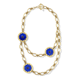 Sunburst Layering Necklace in 14k gold plate with three lapis sun medallions on a spiked link chain, top view