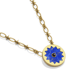 Sunburst Pendant Necklace in 14k gold plate with a lapis and black onyx sun medallion, three-quarter view
