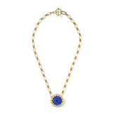 Sunburst Pendant Necklace in 14k gold plate with a lapis and black onyx sun medallion, top view