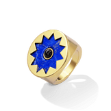 Sunburst Signet Ring in 14k gold plate with a lapis sun and black onyx center on a flat signet face, upright three-quarter view
