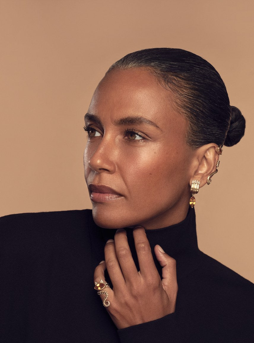 Model in a black turtleneck wearing the Tigerlily Citrine Claw Earrings and Pinky Ring