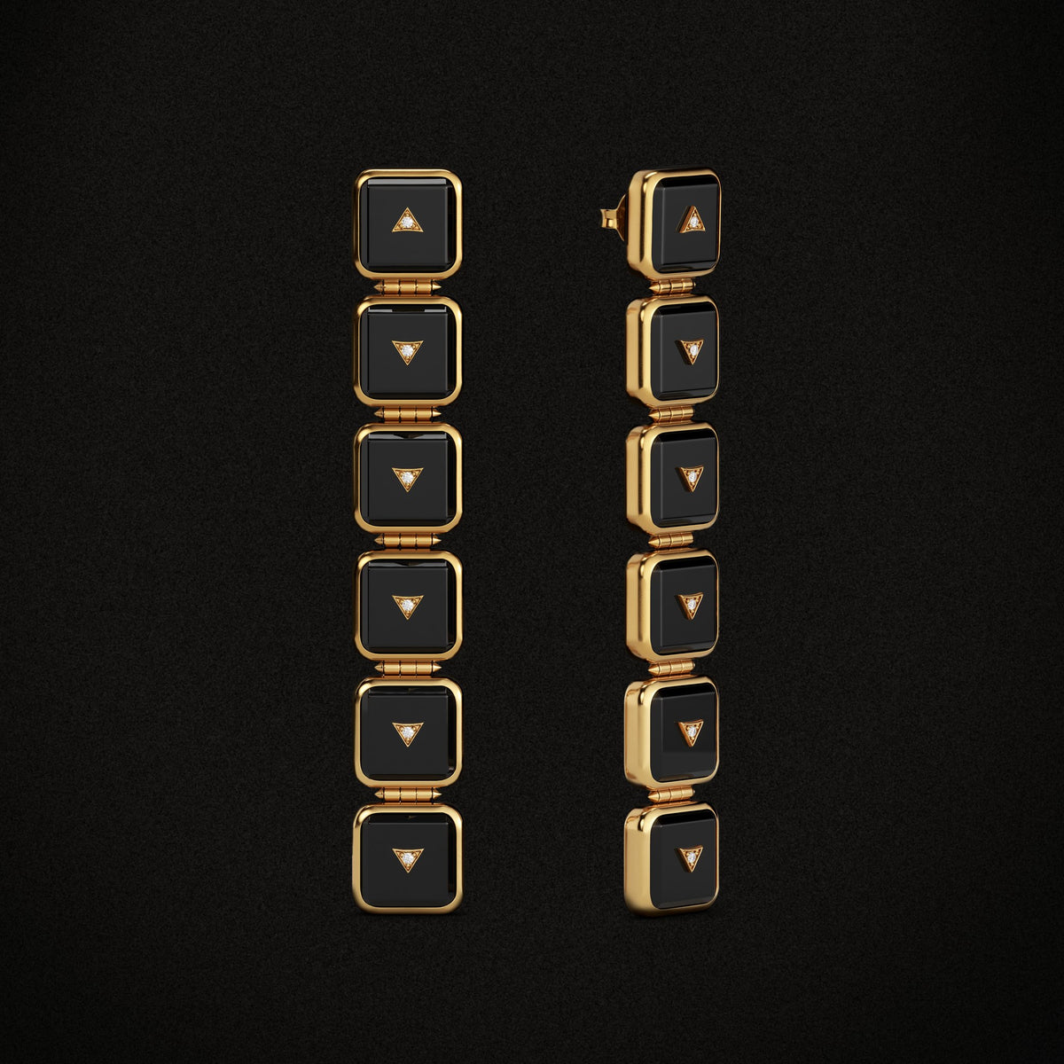 Nova Stacker Drop Earrings in black onyx and gold, three-quarter view on a black background