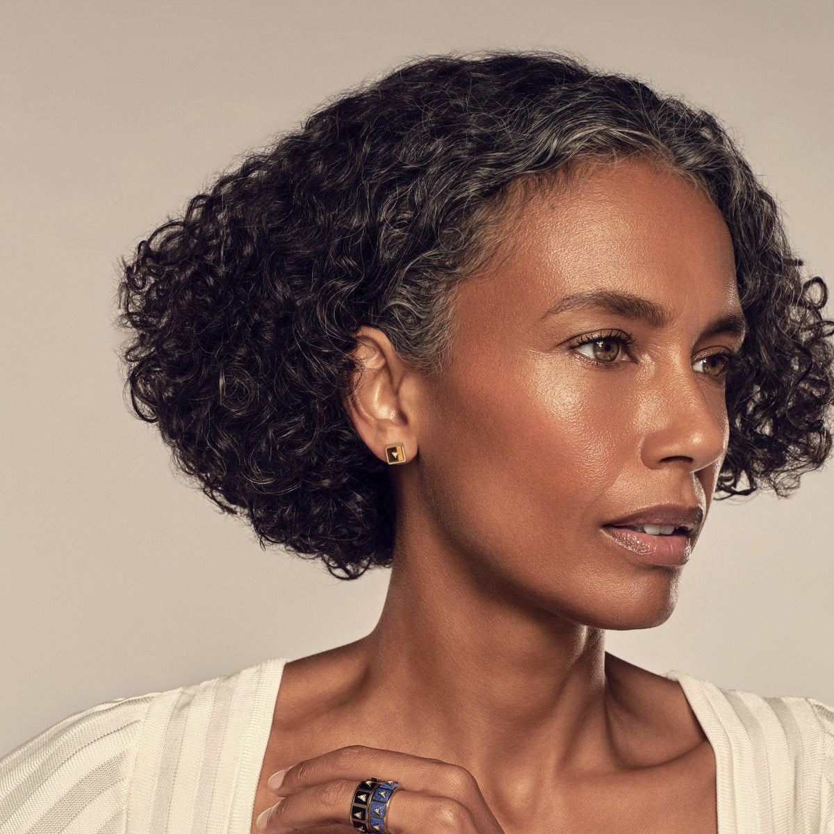 Model in profile wearing the Nova Stud Earrings in tiger's eye #stone_Tiger's Eye
