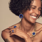 Model wearing the Sunburst Cocktail Ring in blue lapis with the Sunburst Statement Earrings and Layering Necklace