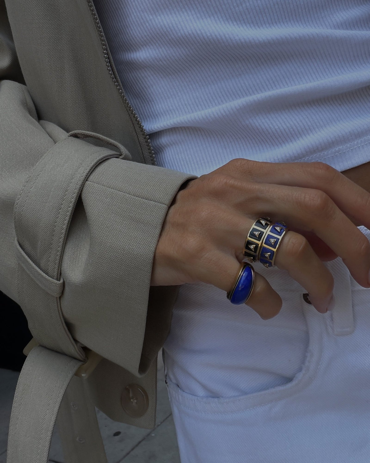 Sunburst Cocktail Ring in lapis stacked with Nova Stacker Rings in black onyx, worn with a trench and white jeans