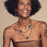 Model wearing the Sunburst Layering Necklace in blue lapis