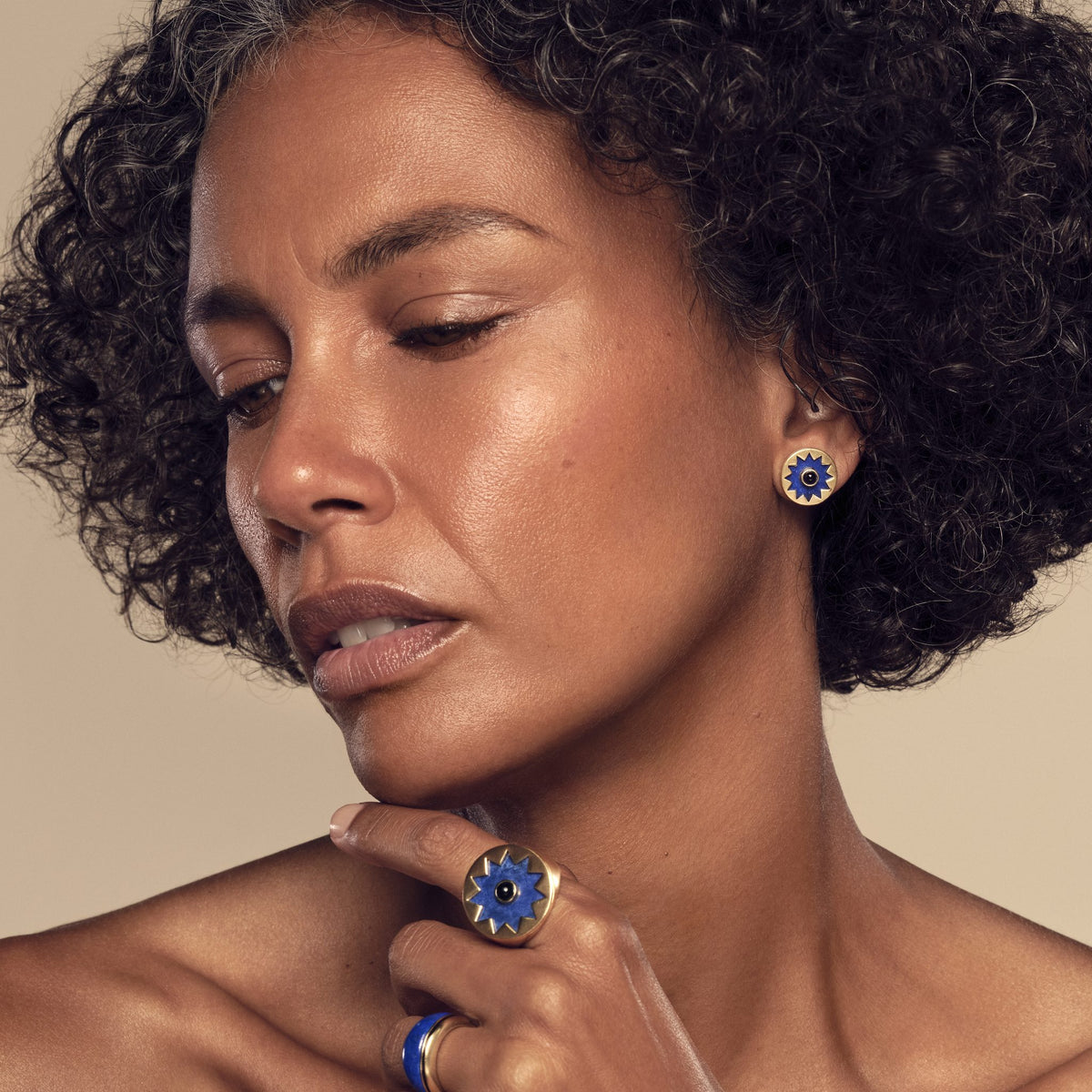 Model wearing the Sunburst Signet Ring and Stud Earrings in blue lapis #color_14k Gold Plated Sterling Silver